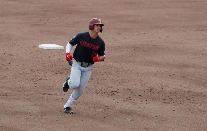 Jun 21, 2021; Omaha, Nebraska, USA; Stanford Cardinal designated hitter Tommy Troy (12) rounds the bases after hitting a home run against the Arizona Wildcats at TD Ameritrade Park. Mandatory Credit: Bruce Thorson-USA TODAY Sports